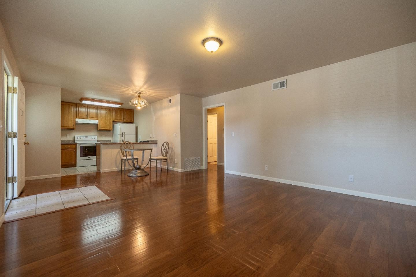 207 Watson Drive, Unit 1 Campbell, CA 95008 - Photo 3 of 17 a view of kitchen with furniture and wooden floor