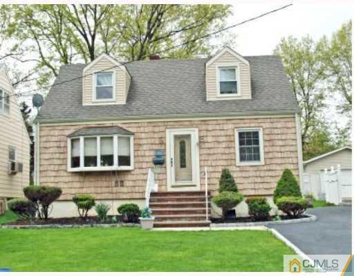 45 Kimberly Road Colonia, NJ 07067 - Photo 1 of 10 a front view of a house with a yard