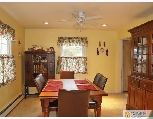 45 Kimberly Road Colonia, NJ 07067 - Photo 3 of 10 a view of a dining room with furniture and a window