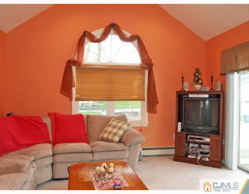 45 Kimberly Road Colonia, NJ 07067 - Photo 4 of 10 a living room with furniture and a flat screen tv