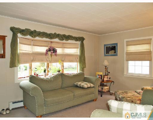 45 Kimberly Road Colonia, NJ 07067 - Photo 6 of 10 a living room with furniture and a large window