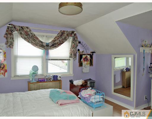 45 Kimberly Road Colonia, NJ 07067 - Photo 7 of 10 a living room with furniture and a large window
