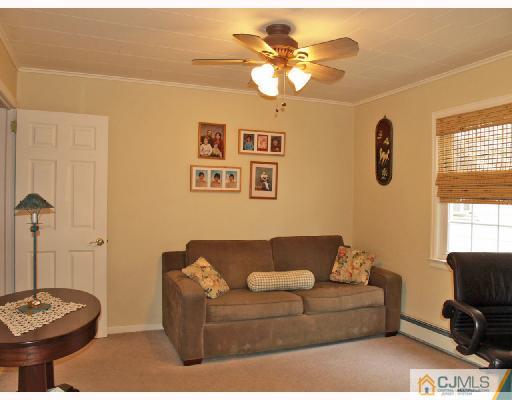 45 Kimberly Road Colonia, NJ 07067 - Photo 9 of 10 a living room with furniture and a window