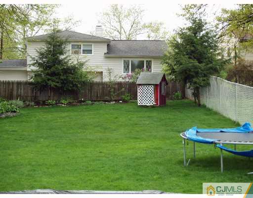 45 Kimberly Road Colonia, NJ 07067 - Photo 10 of 10 a view of a chair and table in backyard of the house