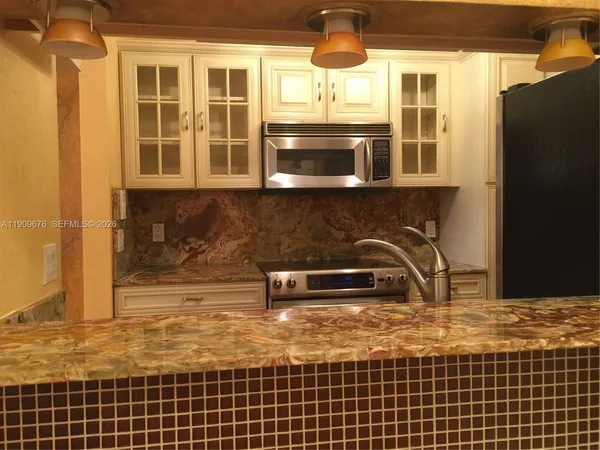a utility room with a sink a washer and dryer