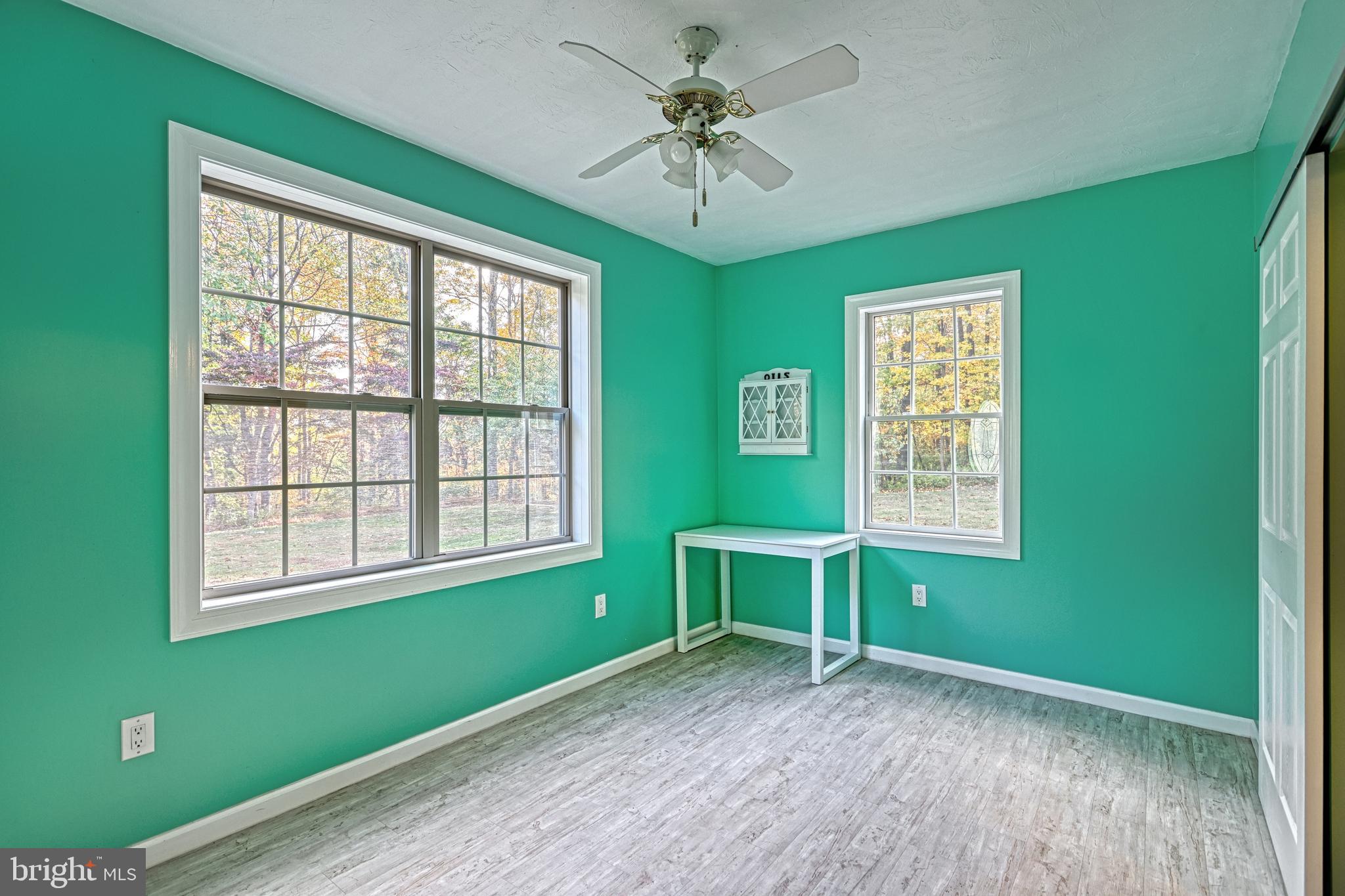 90 Buck Road Dover, PA 17315 - Photo 54 of 107 a view of an empty room with window and wooden floor