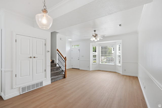 793 North 150 E Street Springville, UT 84663 - Photo 4 of 26 Expansive living area with light wood-finish flooring, a bay window, and a ceiling fan
