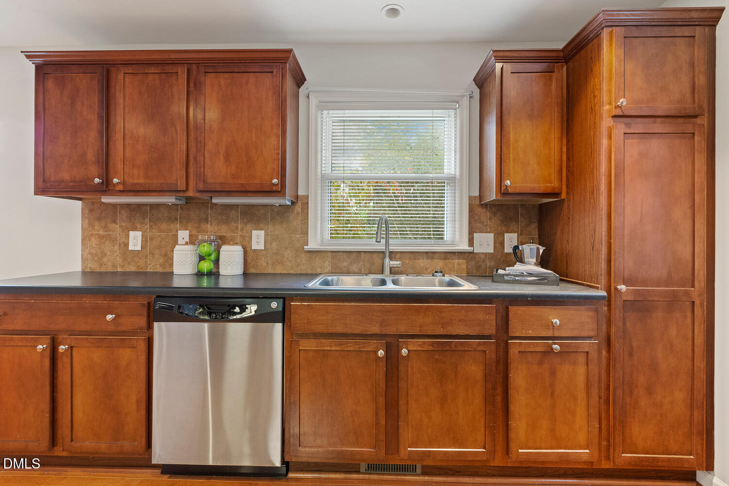 5401 Kaplan Drive Raleigh, NC 27606 - Photo 12 of 41 a kitchen with granite countertop wooden cabinets and a sink