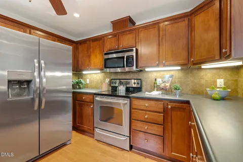a kitchen with a refrigerator stove and microwave