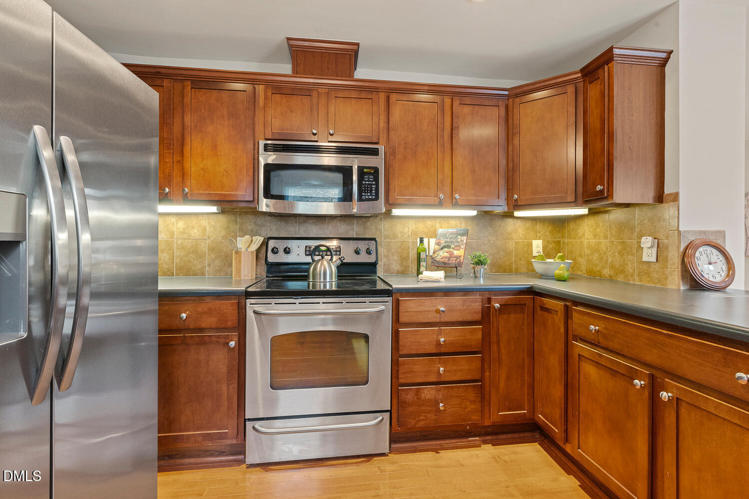 5401 Kaplan Drive Raleigh, NC 27606 - Photo 14 of 41 a kitchen with a refrigerator stove and microwave
