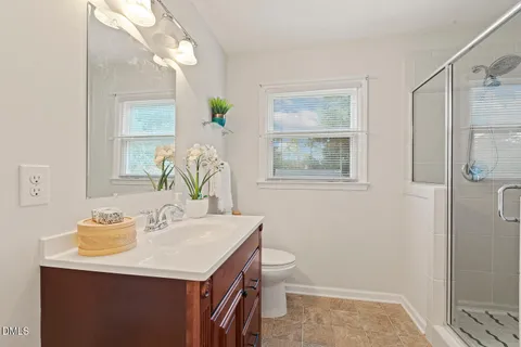 a bathroom with a shower and a sink