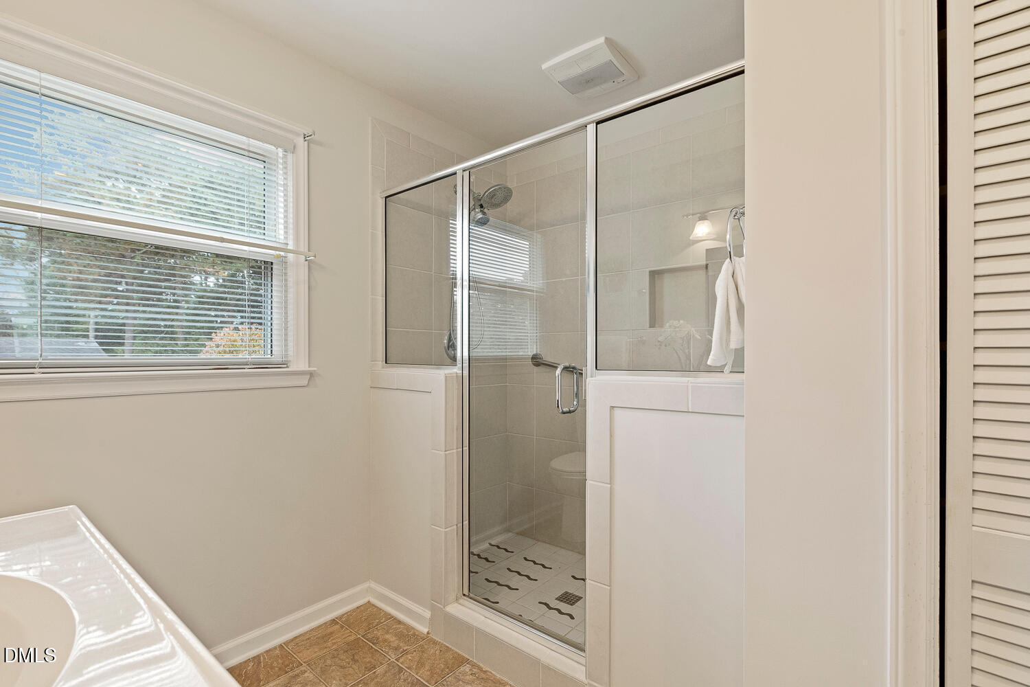 5401 Kaplan Drive Raleigh, NC 27606 - Photo 19 of 41 a bathroom with a shower and a sink