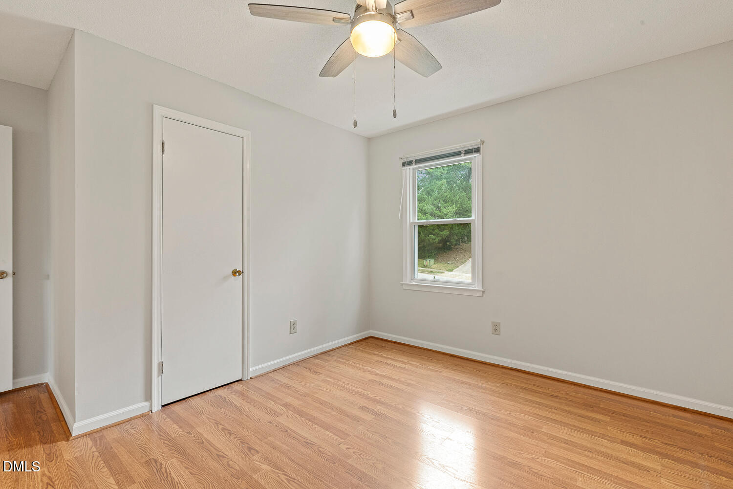 5401 Kaplan Drive Raleigh, NC 27606 - Photo 22 of 41 a view of an empty room with wooden floor and a window