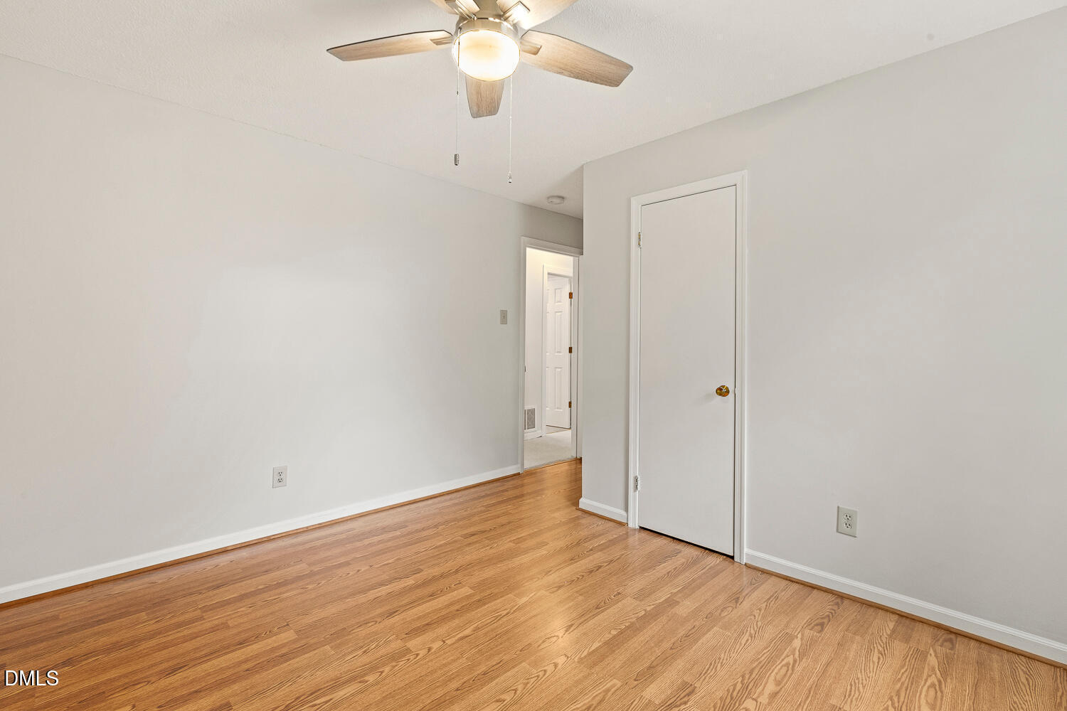 5401 Kaplan Drive Raleigh, NC 27606 - Photo 23 of 41 a view of an empty room with wooden floor