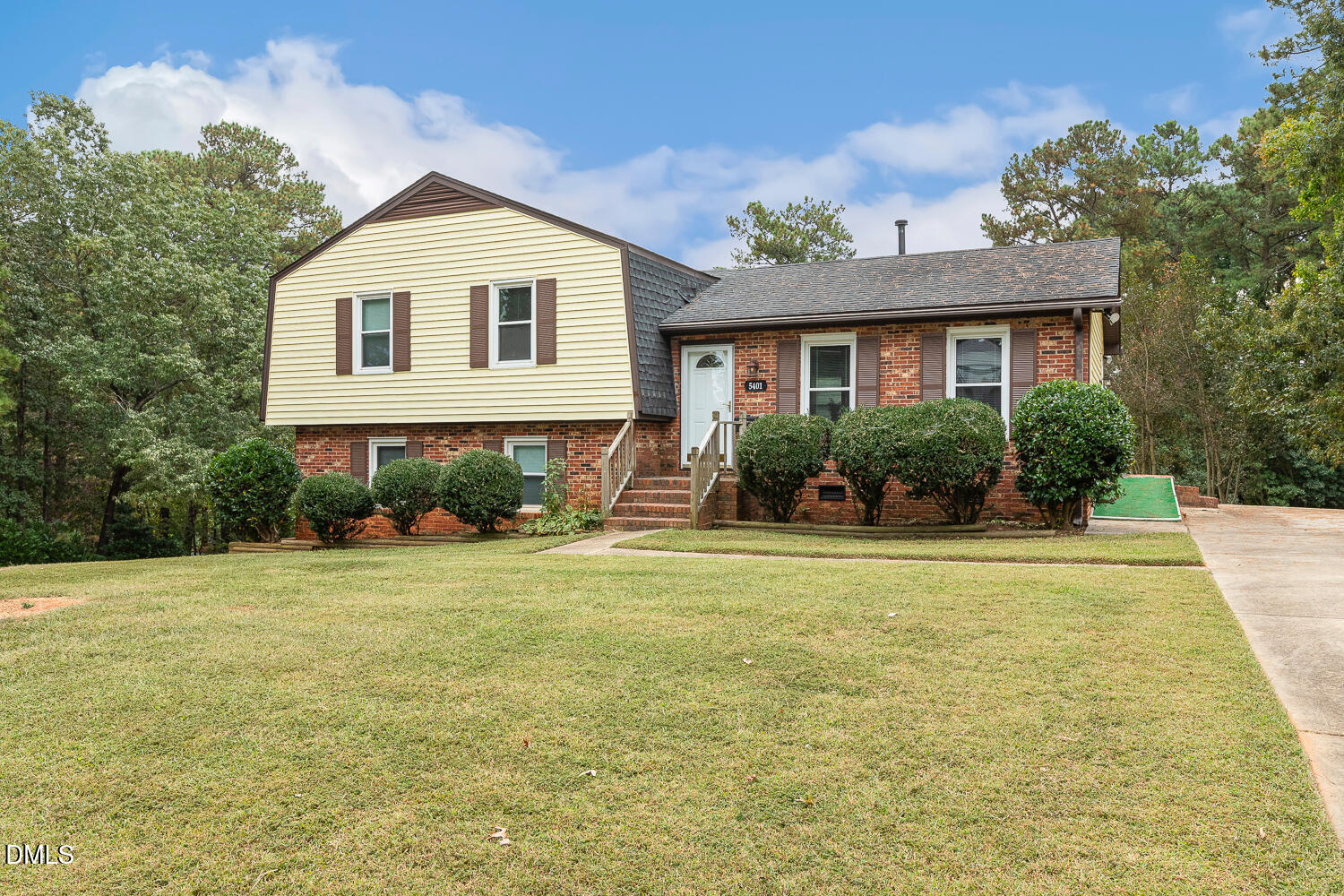5401 Kaplan Drive Raleigh, NC 27606 - Photo 3 of 41 a front view of a house with a yard and potted plants
