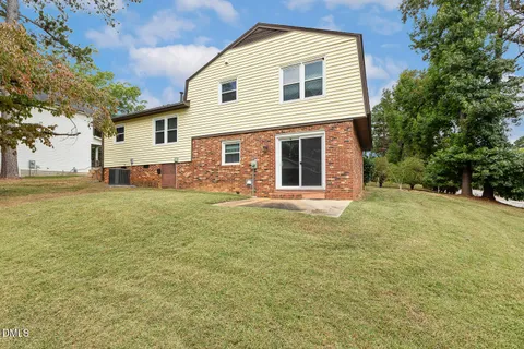 a front view of a house with yard
