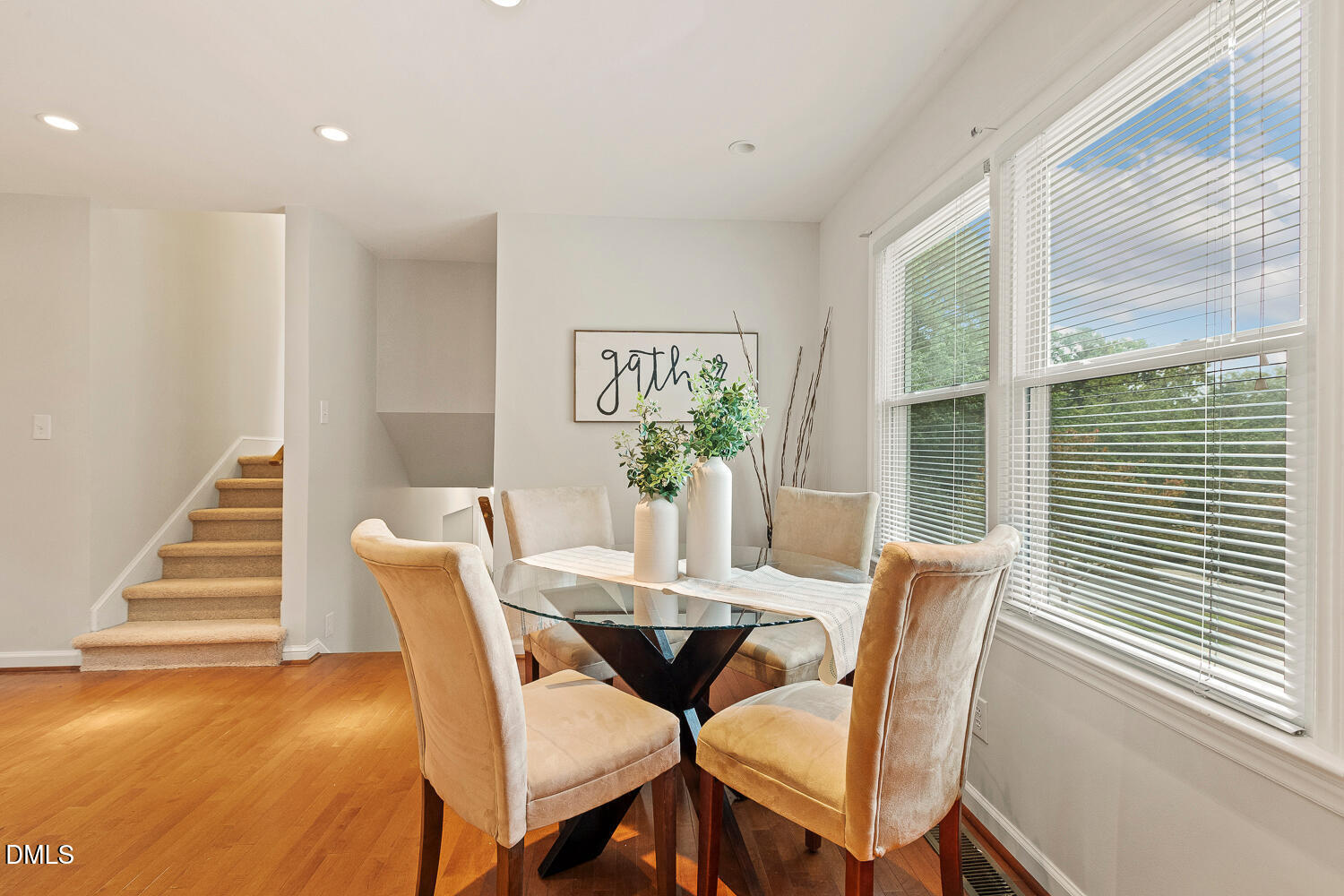5401 Kaplan Drive Raleigh, NC 27606 - Photo 8 of 41 a view of a dining room with furniture a chandelier and wooden floor