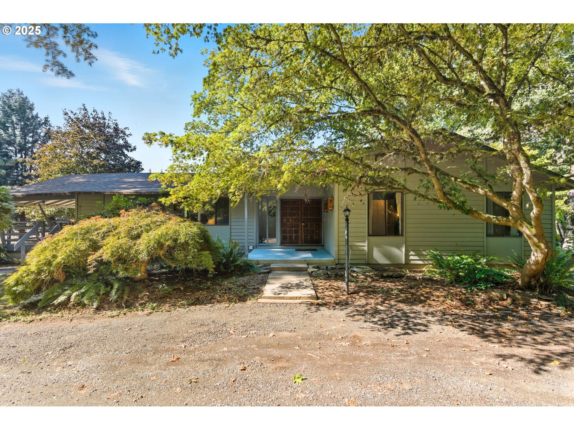 a backyard of a house with lots of green space