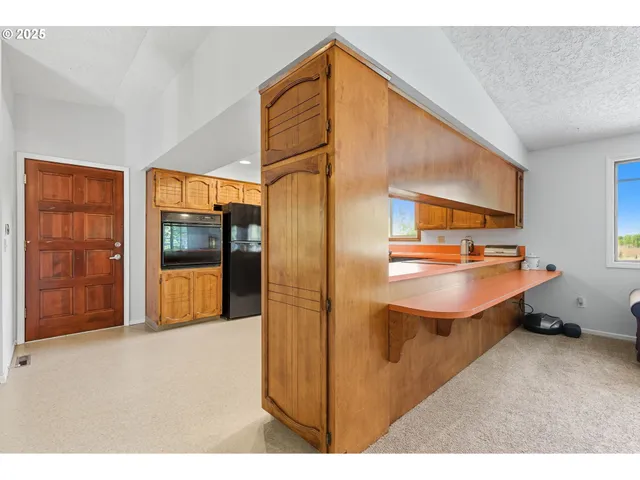 a living room with a couch and a floor to ceiling window