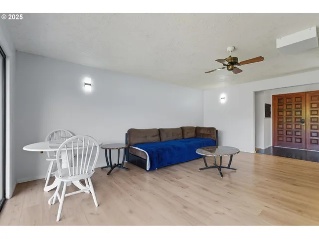 a view of a livingroom with furniture and cabinet