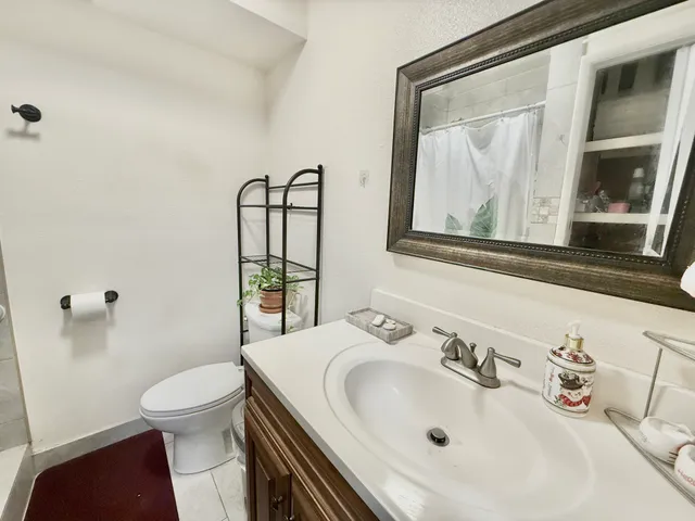 a view of a wooden house with a yard