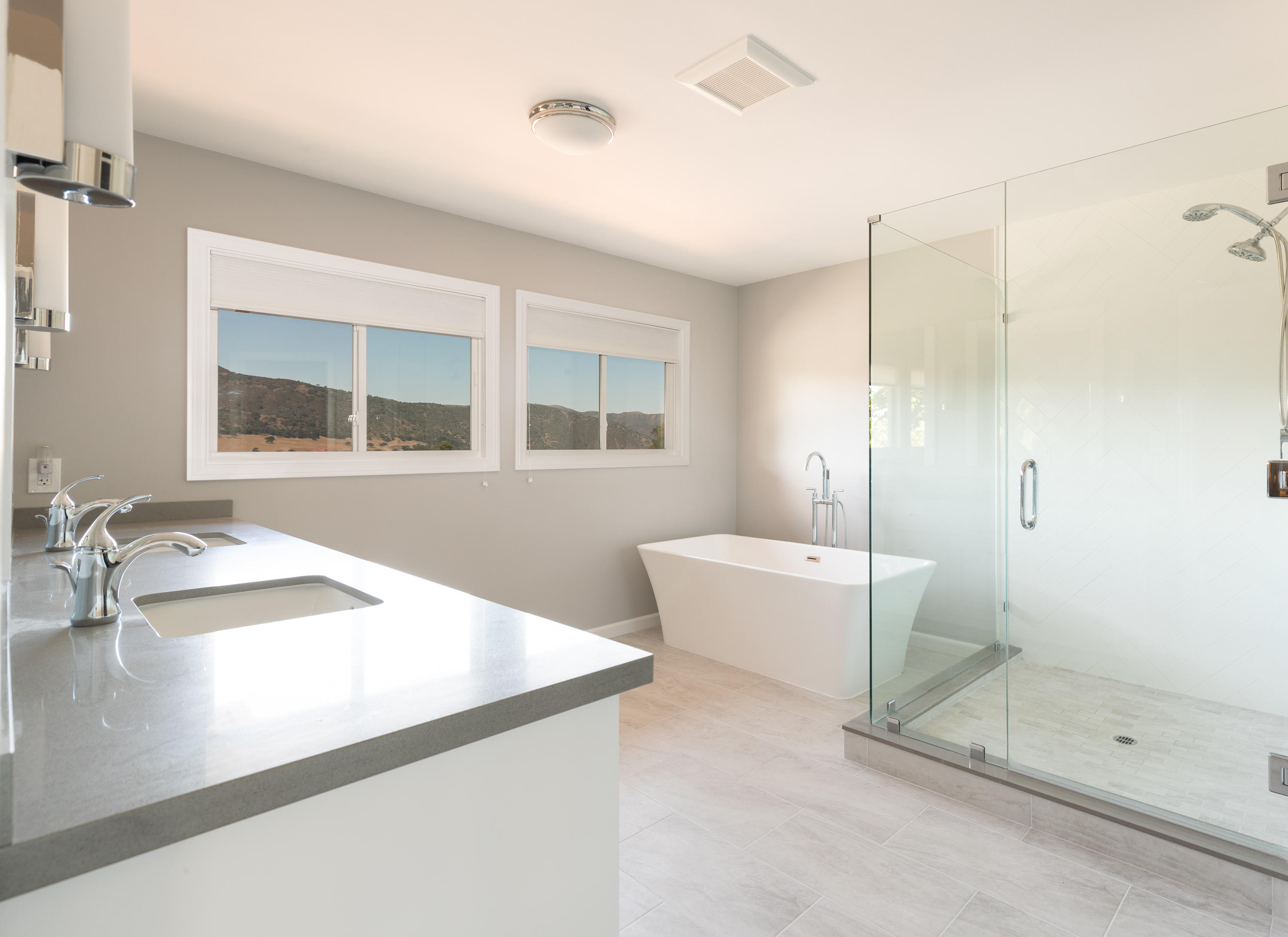 705 Mesa Drive Solvang, CA 93463 - Photo 11 of 22 a bathroom with a granite countertop sink mirror and bathtub