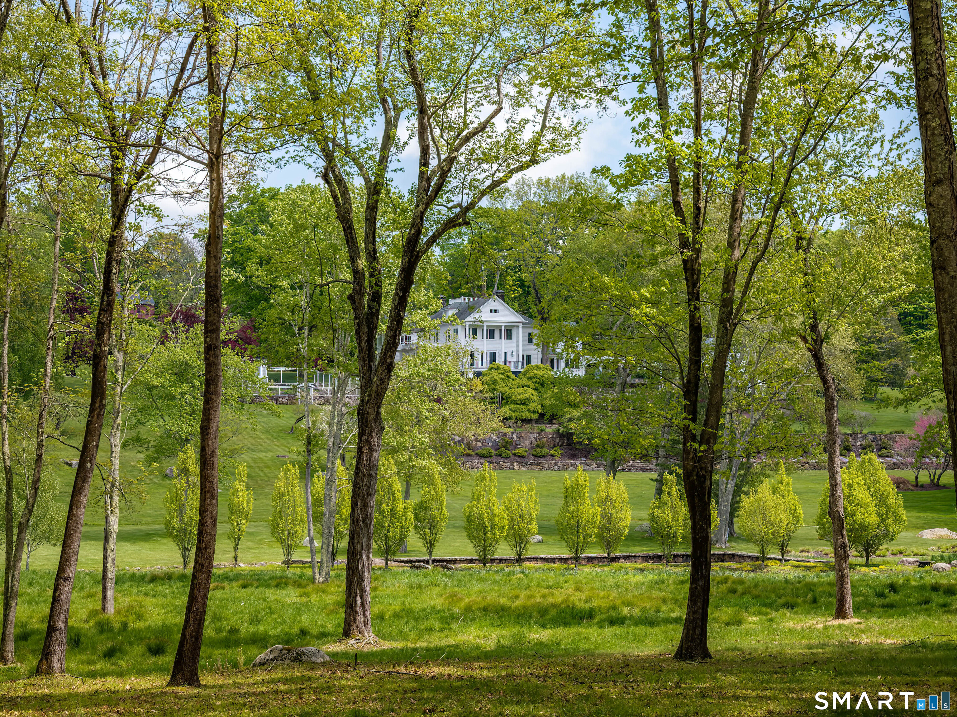 155 Long Ridge Road Danbury, CT 06810 - Photo 12 of 40 Seen from the trails, the house feels private and beautifully sited within its wider landscape.