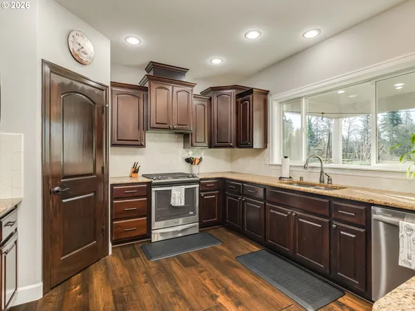 a kitchen with a sink and a large window