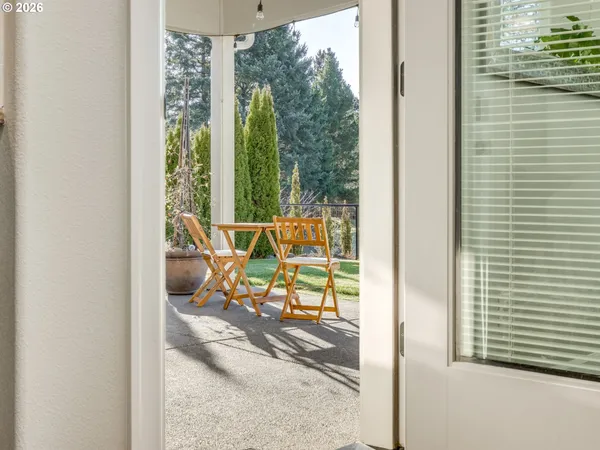 a building outdoor space with patio furniture and potted plants