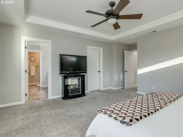 a spacious bathroom with a granite countertop sink mirror and a shower