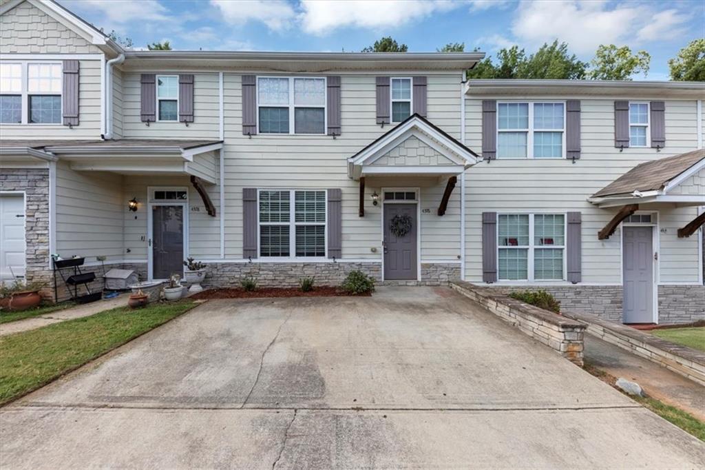 front view of a house with a yard