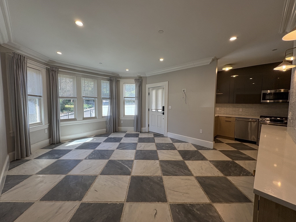 15 Lanark Road, Unit G Brookline, MA 02445 - Photo 12 of 30 a view of a black and white checkered floor with a rug