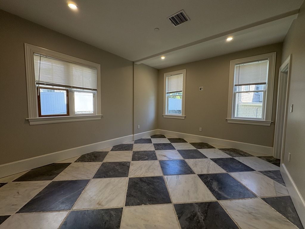 15 Lanark Road, Unit G Brookline, MA 02445 - Photo 13 of 30 a black and white checkered floor