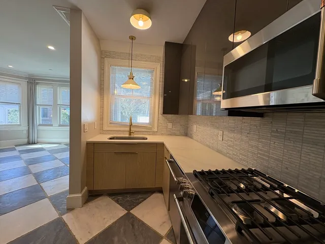 a kitchen with a stove and a microwave