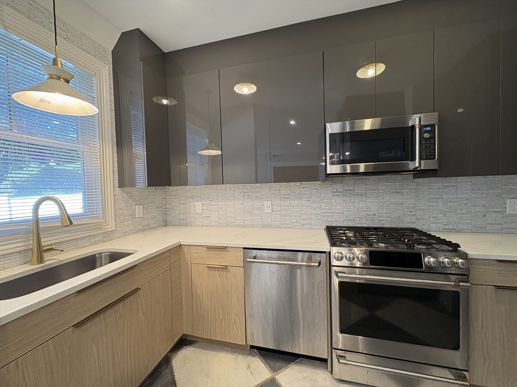 15 Lanark Road, Unit G Brookline, MA 02445 - Photo 4 of 30 a kitchen with a sink stove and microwave
