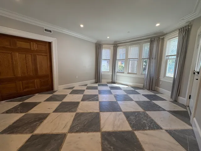 a view of a big room with windows