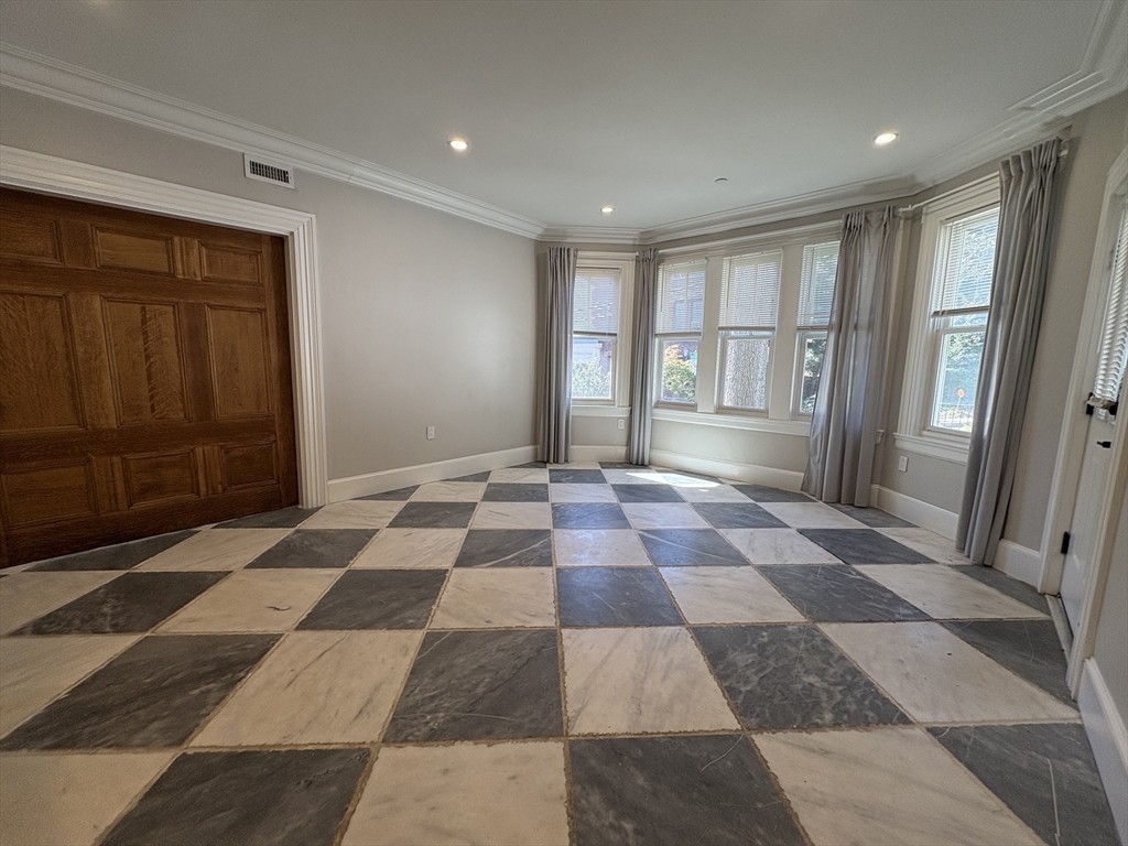 15 Lanark Road, Unit G Brookline, MA 02445 - Photo 8 of 30 a view of a big room with windows