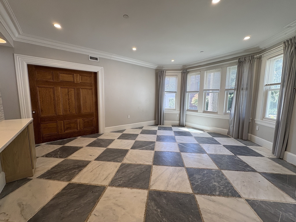 15 Lanark Road, Unit G Brookline, MA 02445 - Photo 9 of 30 a black and white checkered floor with a rug