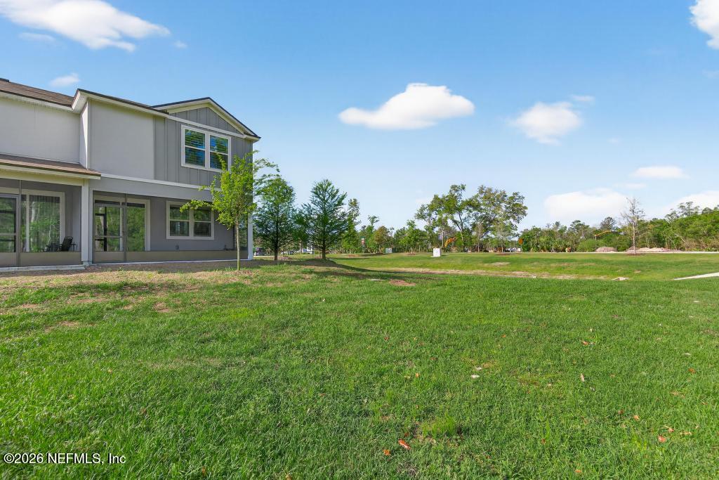 45 Seaport Breeze Road St. Augustine, FL 32095 - Photo 81 of 88 a front view of a house with a yard