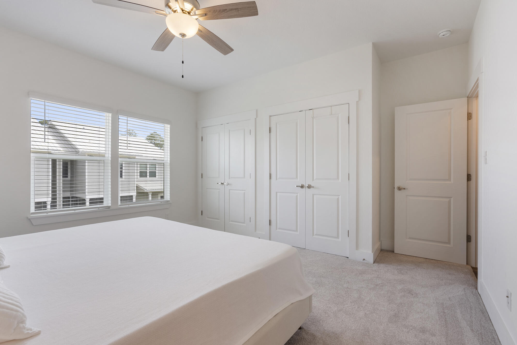 36 Date Palm Lane Freeport, FL 32439 - Photo 12 of 26 a view of a bedroom with a ceiling fan and a window