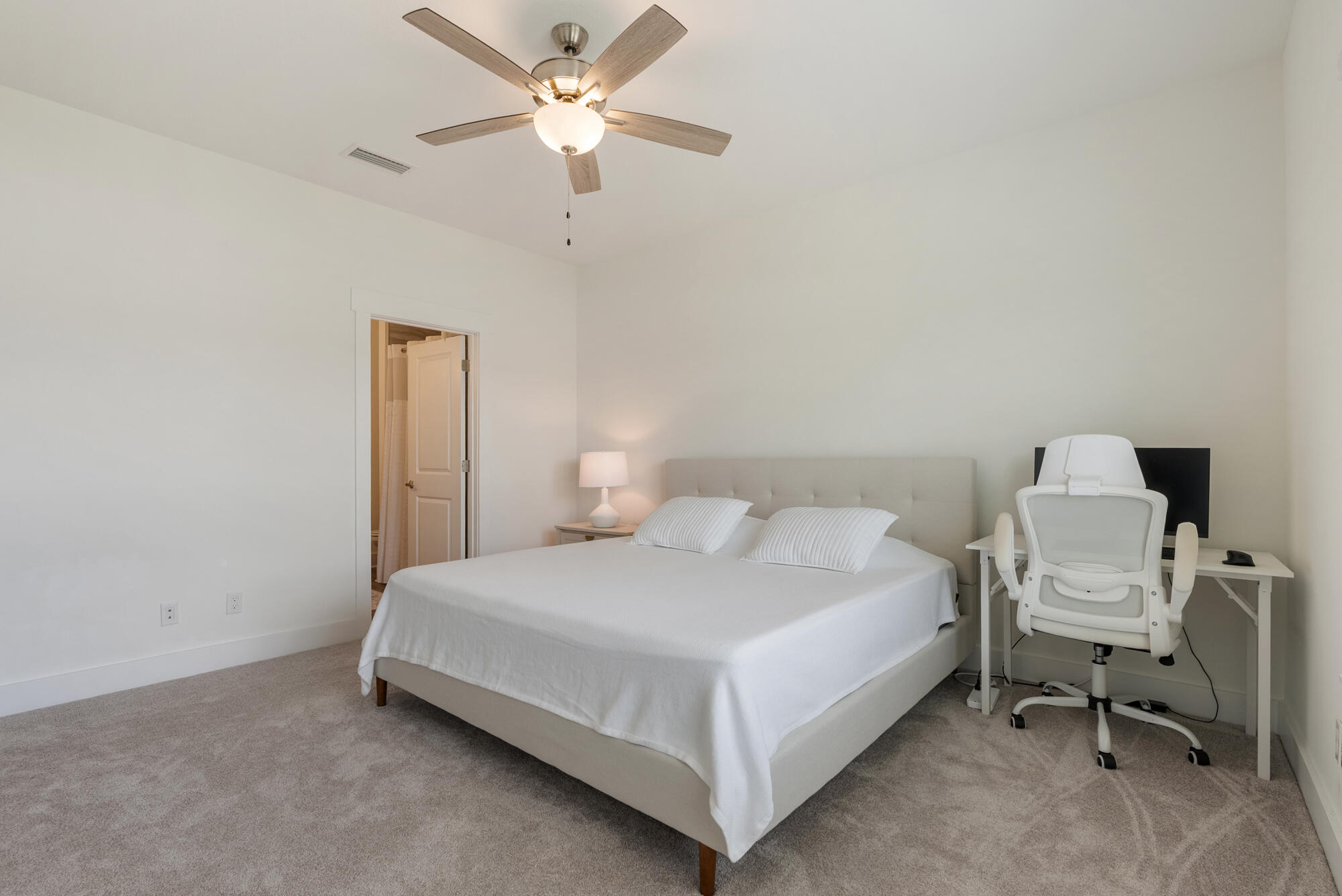 36 Date Palm Lane Freeport, FL 32439 - Photo 13 of 26 a bedroom with a bed and a ceiling fan