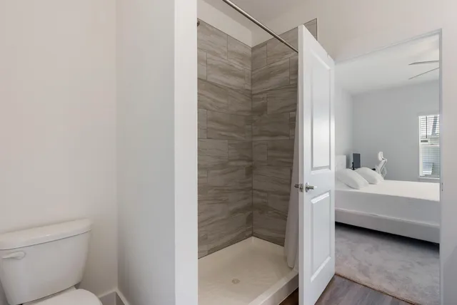 a bathroom with a bathtub and shower