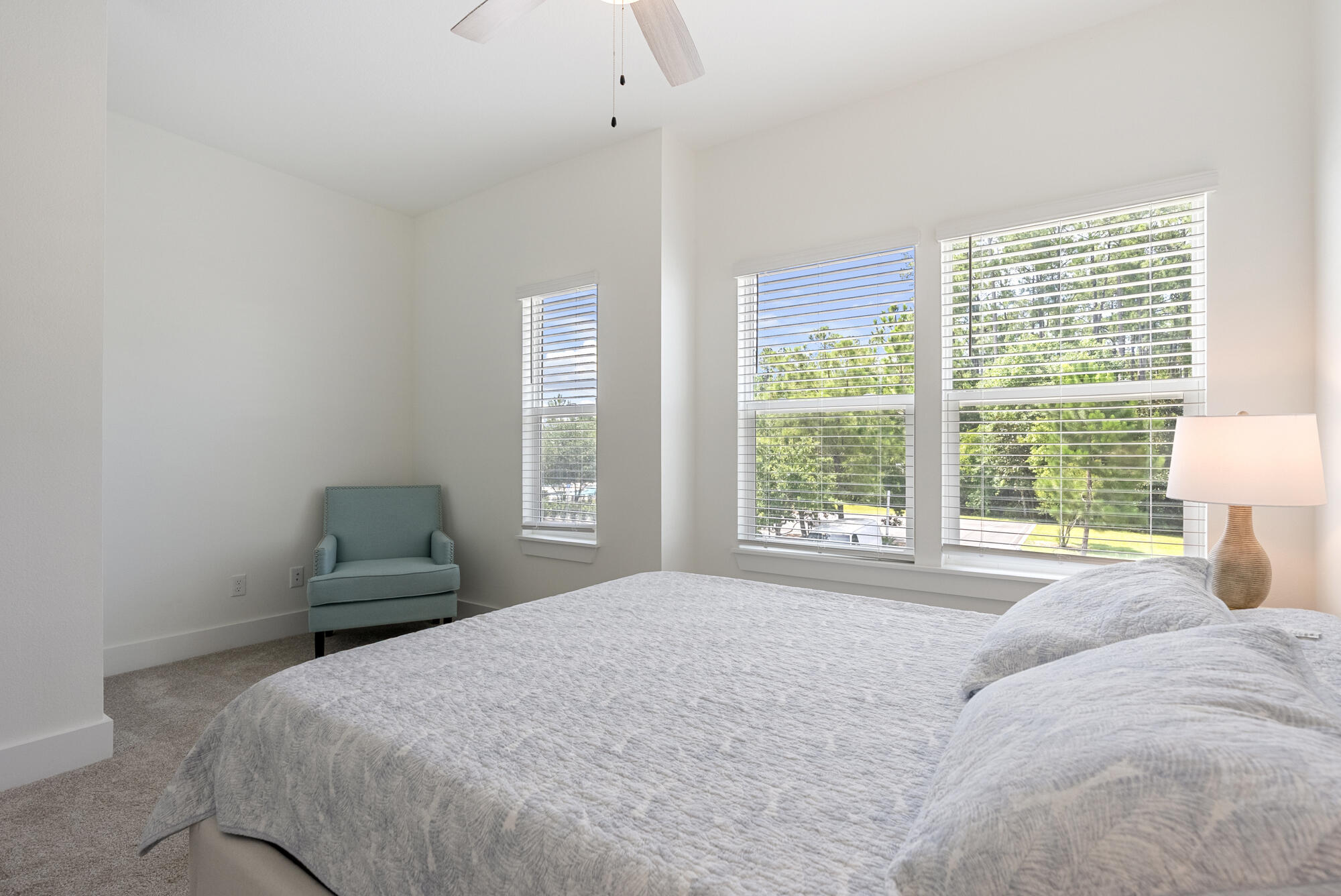 36 Date Palm Lane Freeport, FL 32439 - Photo 17 of 26 a bedroom with a bed and a lamp