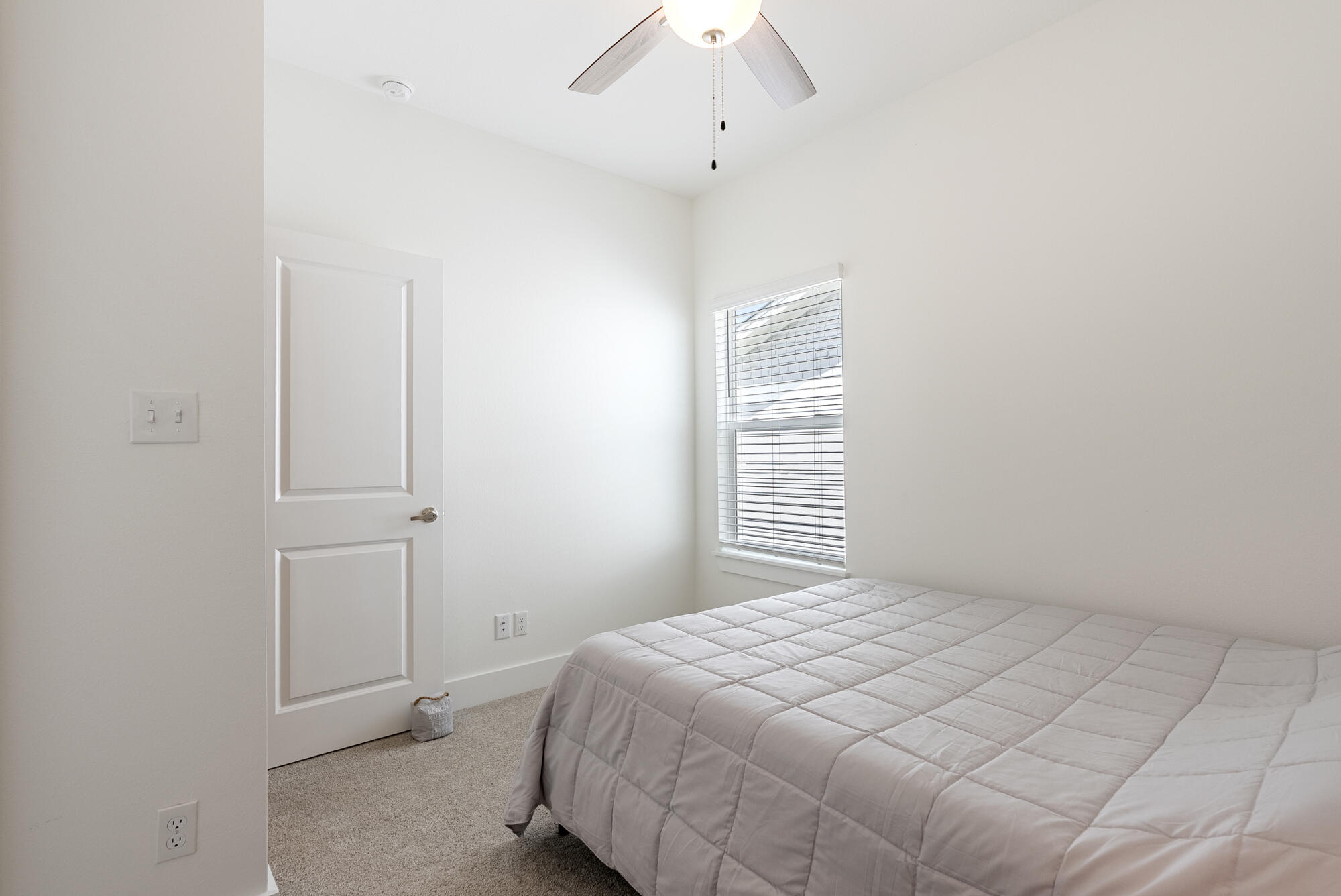 36 Date Palm Lane Freeport, FL 32439 - Photo 20 of 26 a bedroom with a bed and a window