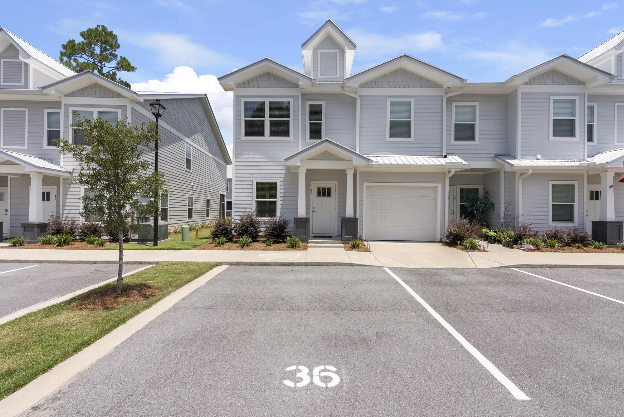 36 Date Palm Lane Freeport, FL 32439 - Photo 2 of 26 a front view of a house with a yard