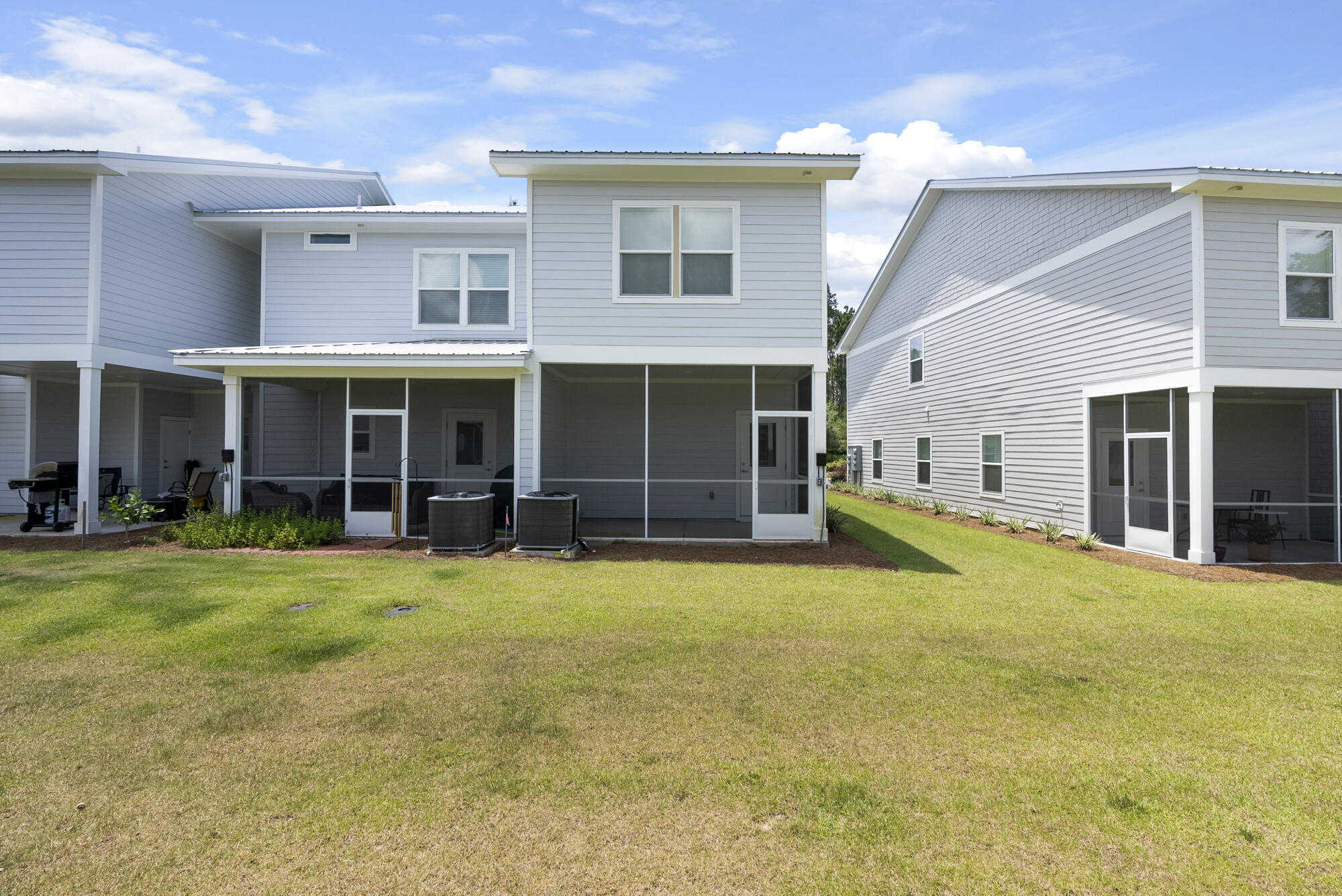 36 Date Palm Lane Freeport, FL 32439 - Photo 25 of 26 a view of a house with a yard and sitting area