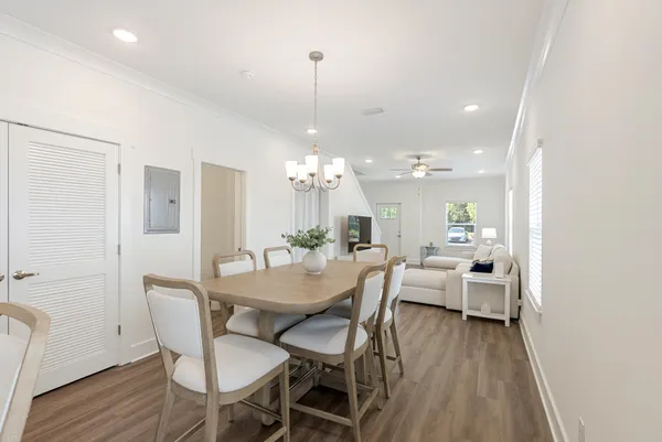 a view of a dining room with furniture window and wooden floor