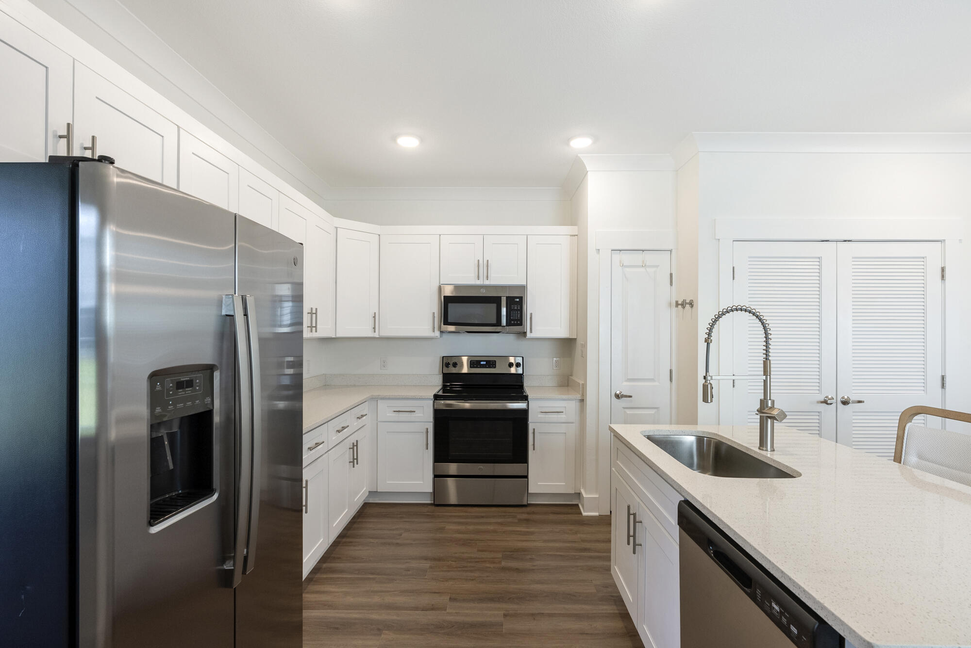 36 Date Palm Lane Freeport, FL 32439 - Photo 9 of 26 a kitchen with stainless steel appliances granite countertop a refrigerator and a sink