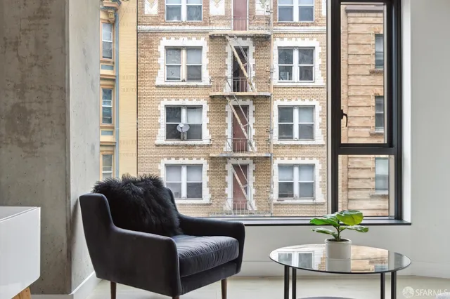 a living room with furniture and windows