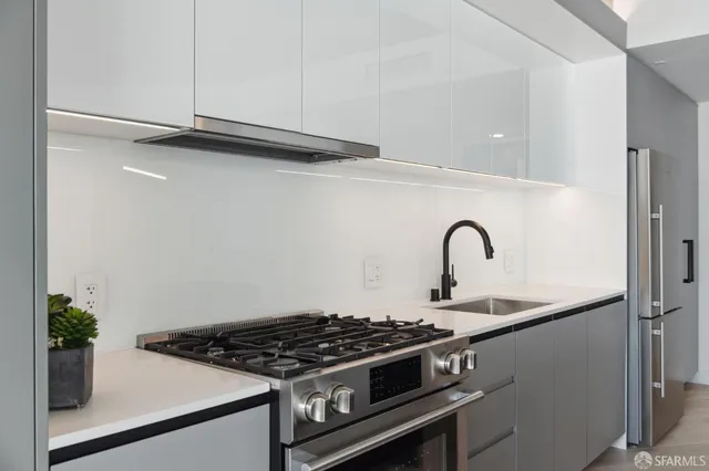 a close view of a stove top oven and sink